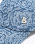 Baseball cap in rose print denim
