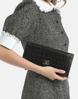Crocodile-print leather clutch