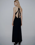 MiLA Boutique black long envers satin dress with halterneck, plunging neckline, and open back with tie detail.
