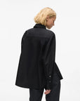 MiLA Boutique black cotton shirt with pointed collar, KARL lettering snap buttons, and split side seams.