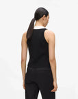 MiLA Boutique black sleeveless knit top with white collar and gold button detail, worn by a model.