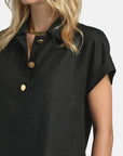 MiLA Boutique black linen shirt with gold buttons, polo collar, cap sleeves, and turn-up cuffs. Regular fit.