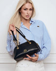 MiLA Boutique blue and white pinstripe cotton shirt with raglan sleeves and Karl patch detail, worn by a woman holding a black handbag.