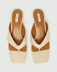 MiLA Boutique cream square-toe flip flops with reptile-print straps and brown leather lining.