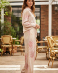 MiLA Boutique light pink satin pyjama set with rose print, long sleeves and straight-leg trousers.