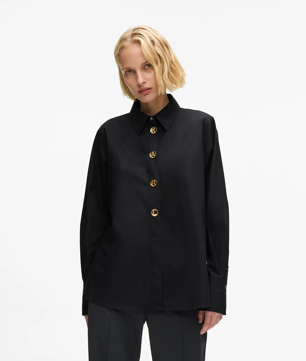 MiLA Boutique black cotton shirt with pointed collar and gold KARL lettered snap buttons, split side seams.