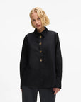 MiLA Boutique black cotton shirt with pointed collar and gold KARL lettered snap buttons, split side seams.