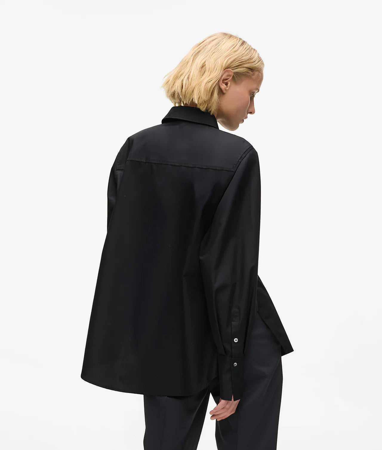 MiLA Boutique black cotton shirt with pointed collar, KARL lettering snap buttons, and split side seams.