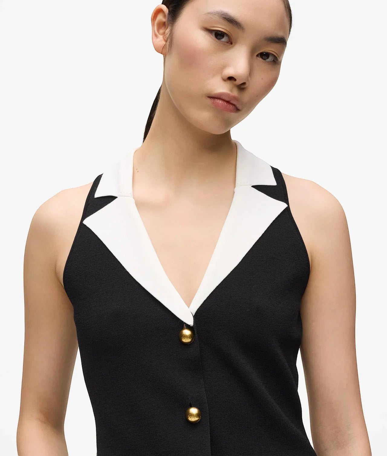 MiLA Boutique sleeveless black knit top with white collar and gold button detail