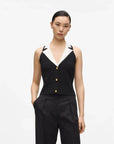 MiLA Boutique sleeveless black knit top with white collar and gold button detail.