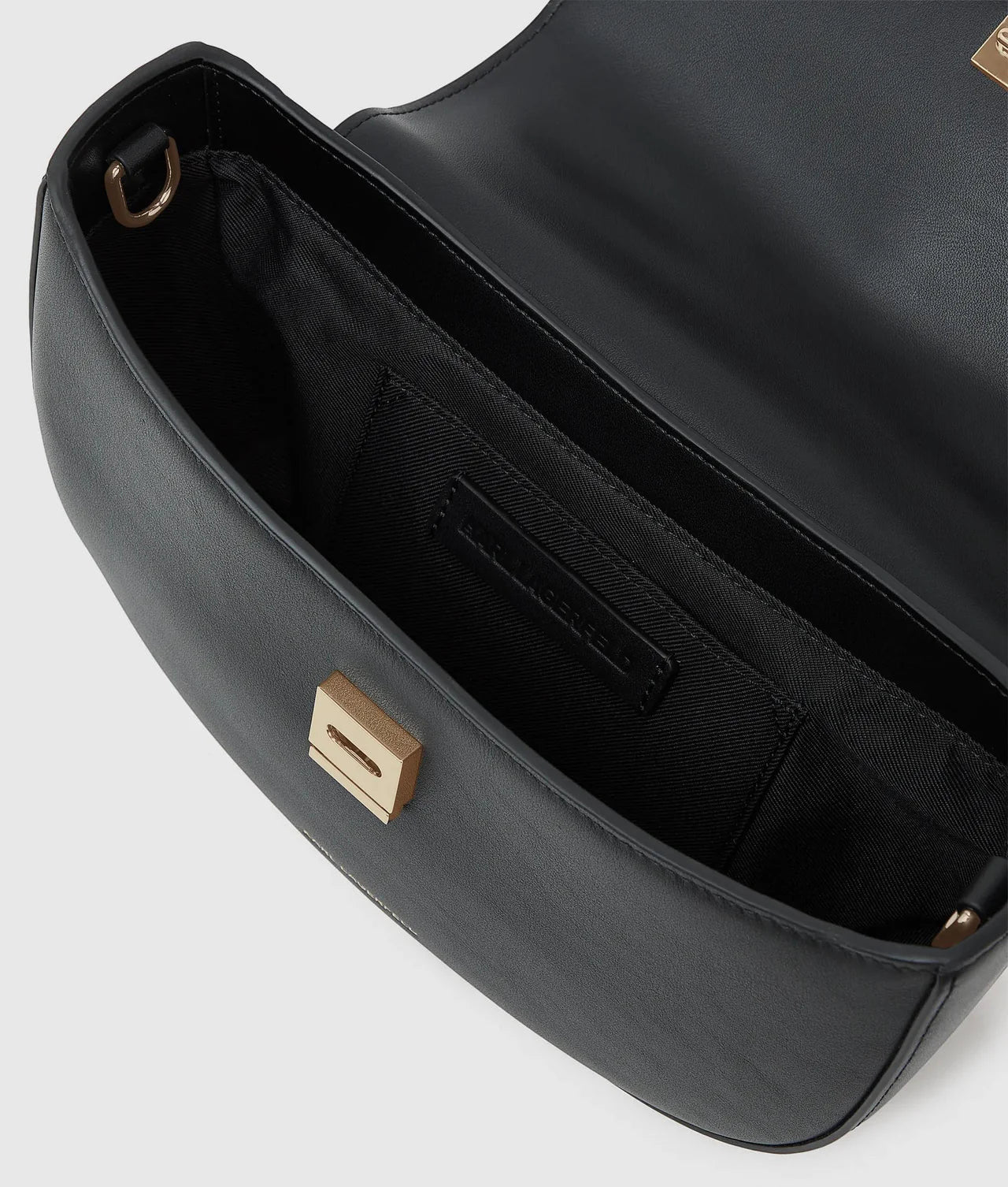 MiLA Boutique black leather Choupette top handle bag with gold push-lock closure and interior logo.
