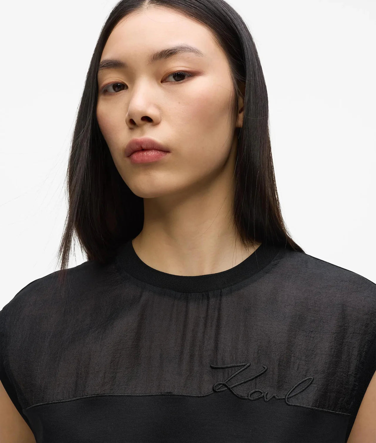 MiLA Boutique black organza tank top with signature embroidery and crew neckline on a model.