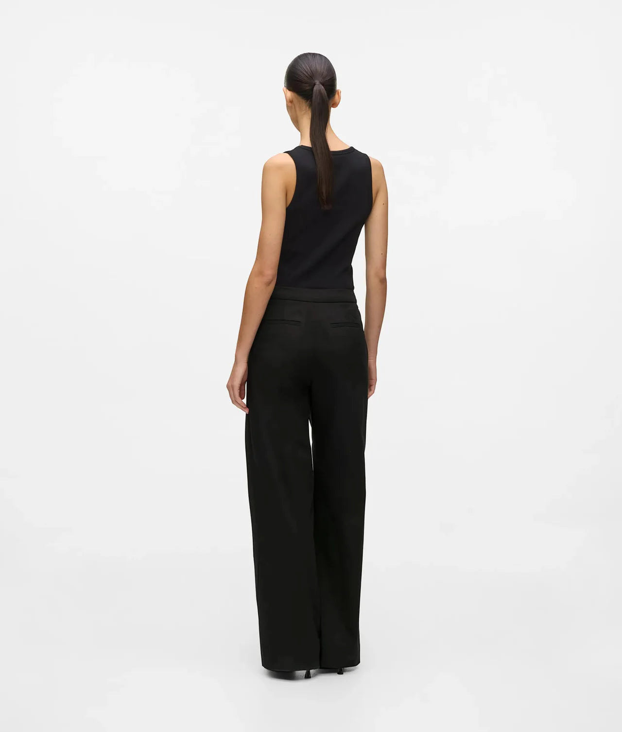 MiLA Boutique black structured suit pants with a wide-leg silhouette and hook-and-eye closure, worn by a model.