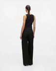 MiLA Boutique black structured suit pants with a wide-leg silhouette and hook-and-eye closure, worn by a model.