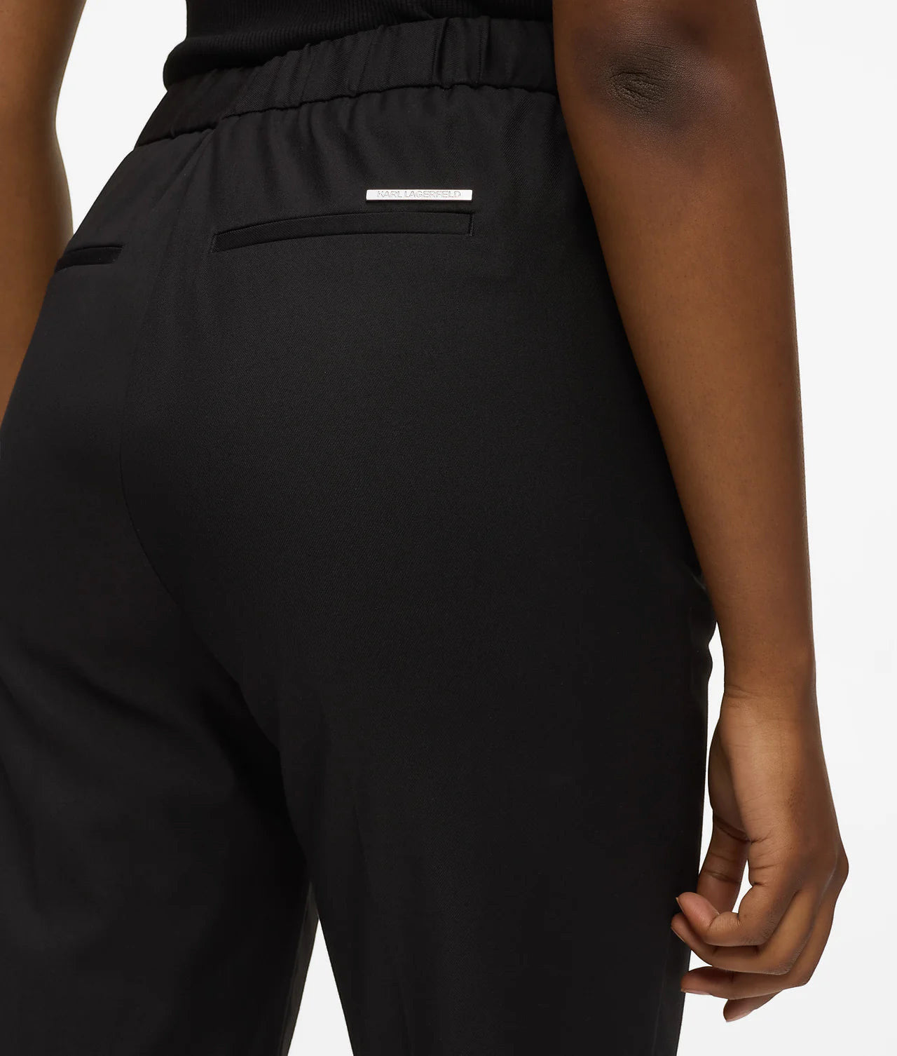 MiLA Boutique black wool-blend tailored pants with elasticated back waistband and Karl Lagerfeld logo rivet.