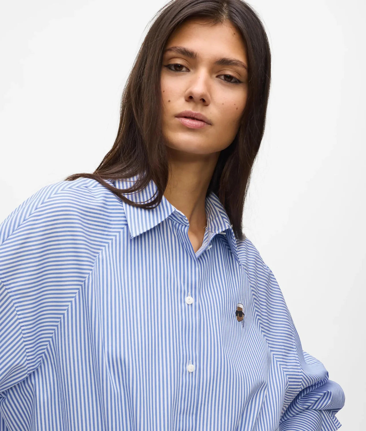 MiLA Boutique blue and white striped cotton shirt with raglan sleeves and embroidered Karl patch on chest.