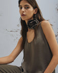 MiLA Boutique brown crinkle twill sleeveless top with rounded neckline and fabric flower accent.