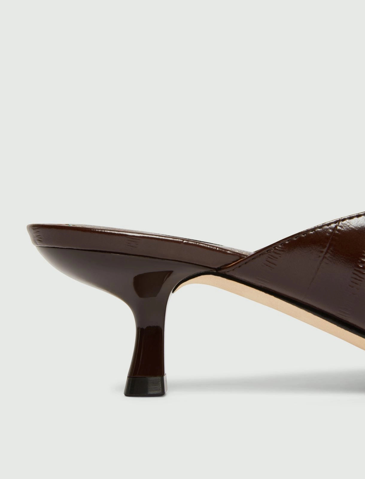 MiLA Boutique brown reptile-print square-toe kitten heel mules with lacquered finish.