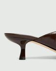 MiLA Boutique brown reptile-print square-toe kitten heel mules with lacquered finish.