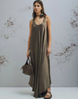 MiLA Boutique brown crinkle twill maxi dress with scoop neck, asymmetrical hem, and fabric belt with flower detail.