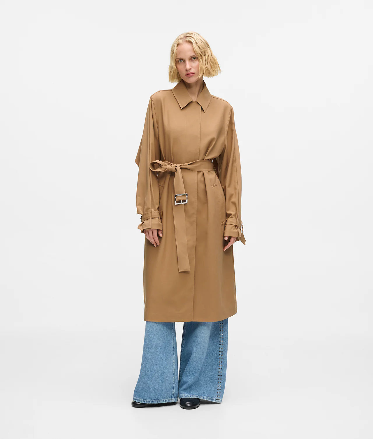 MiLA Boutique camel trench coat with cape detail, spread collar, belted waist, and pleated skirt.