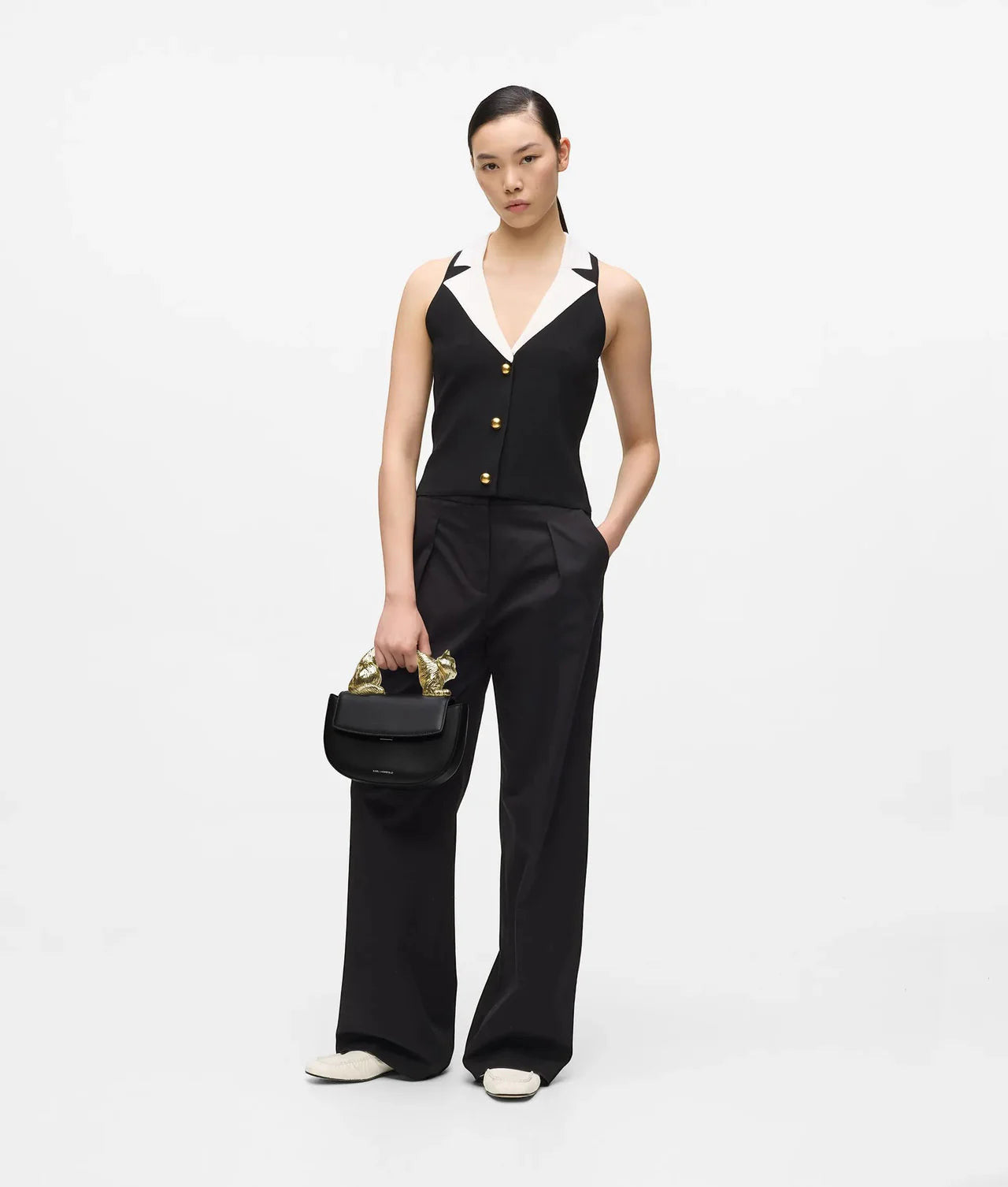 MiLA Boutique Choupette black leather top handle bag with gold cat-shaped handle and push-lock closure.