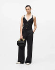 MiLA Boutique Choupette black leather top handle bag with gold cat-shaped handle and push-lock closure.