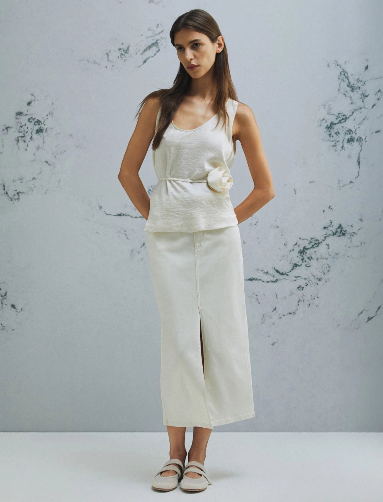 MiLA Boutique cream crinkle twill sleeveless top with rounded neckline and fabric flower accent.