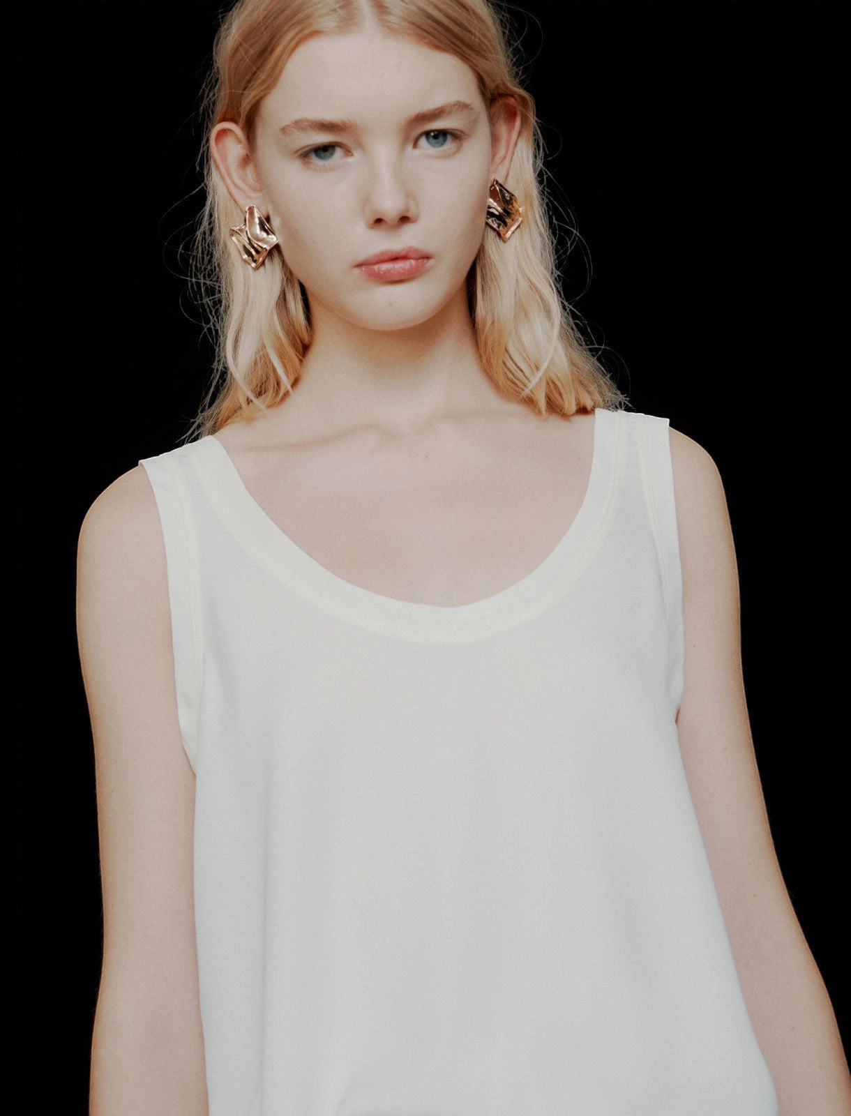 MiLA Boutique cream satin vest top with rounded neckline and spaghetti straps, worn by a blonde model.