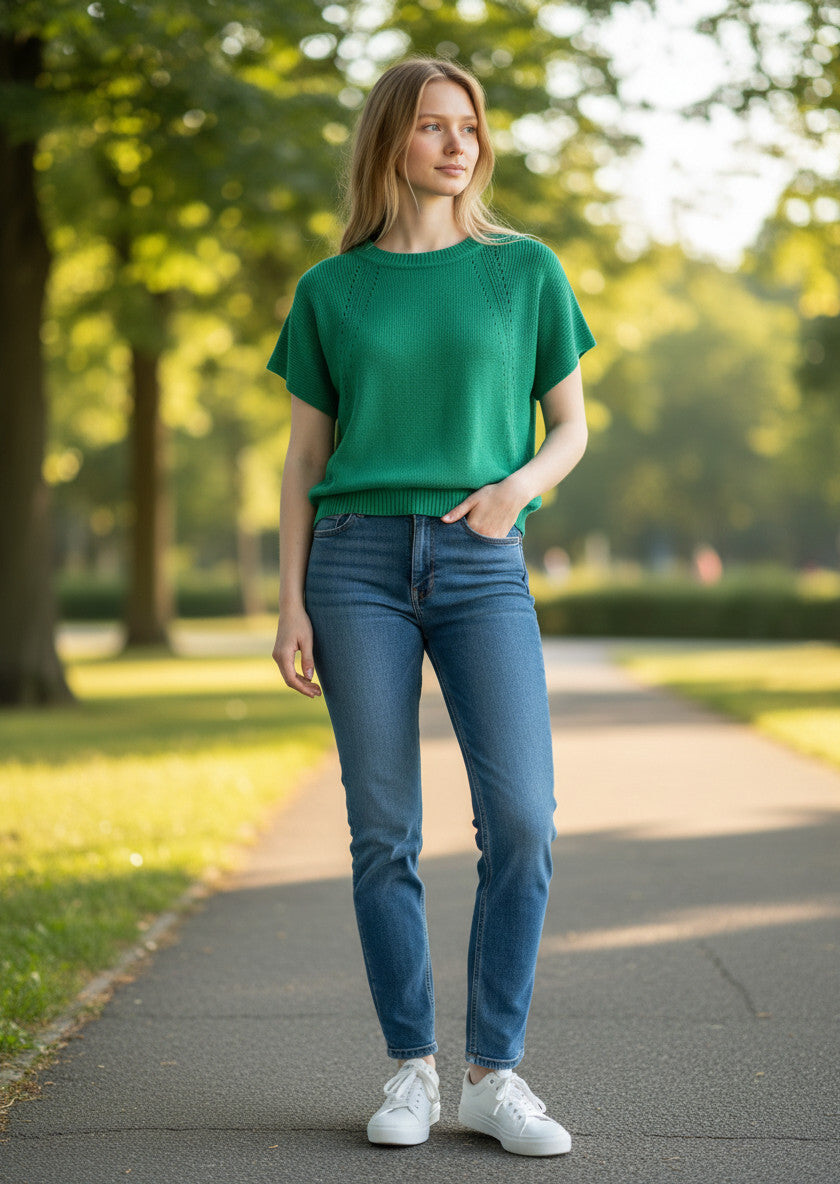 MiLA Boutique emerald green knit top with crew neck and subtle side texture detailing.
