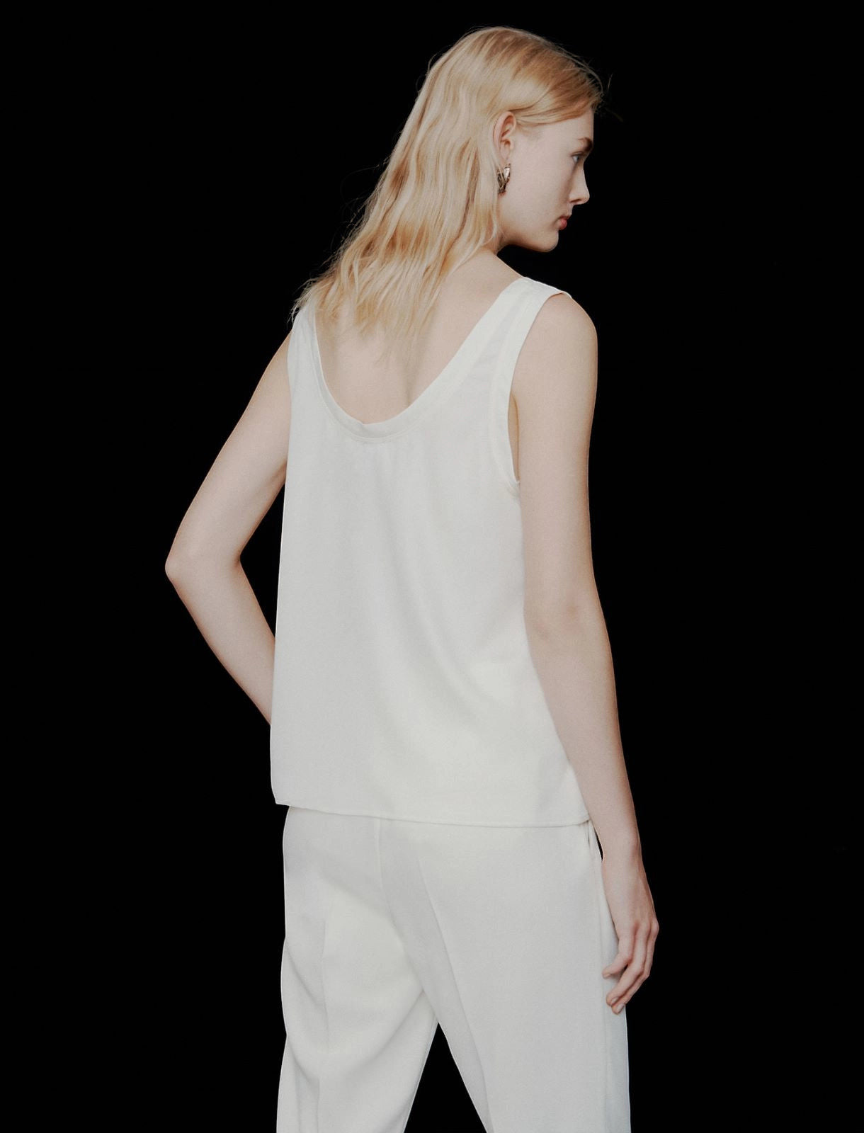 MiLA Boutique ivory satin vest top with rounded neckline and spaghetti straps, worn by a model.
