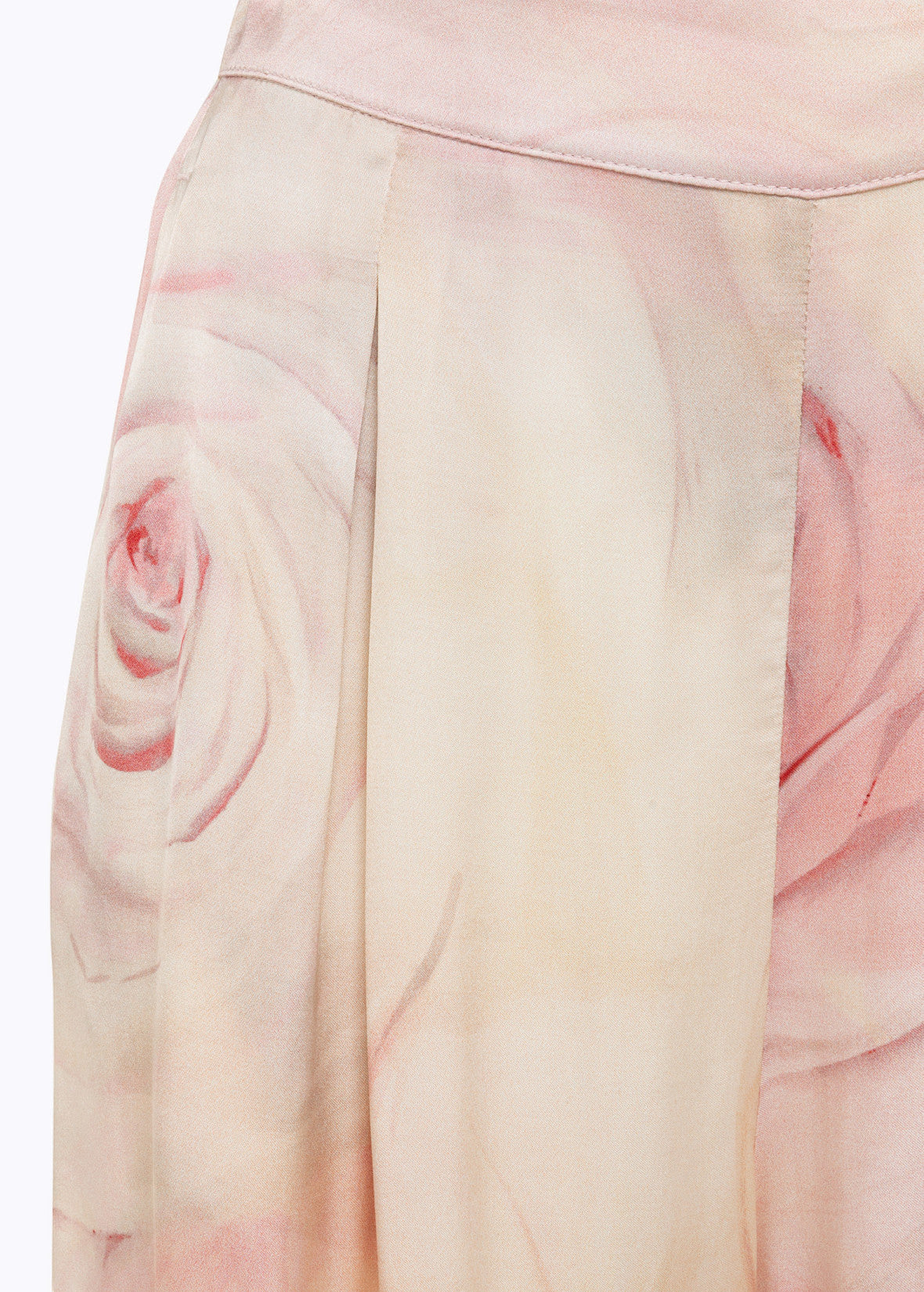 MiLA Boutique wide-leg satin trousers with a delicate rose print in soft pink and cream hues. Features include pleats and a smooth, flowing drape.