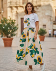 Moschino Jeans cream cotton poplin skirt with all-over sunflower print and elasticated waist.