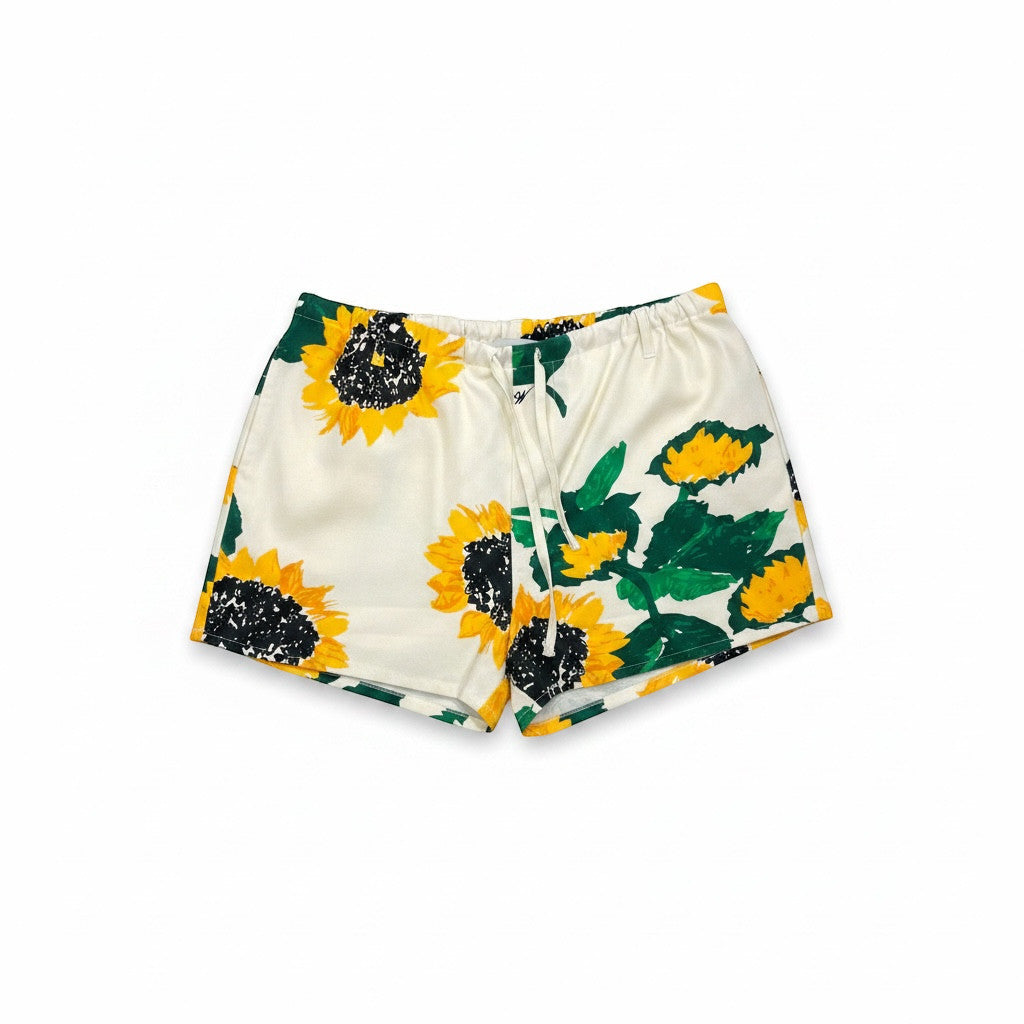MiLA Boutique cream shorts with a vibrant all-over sunflower print and adjustable drawstring waist.