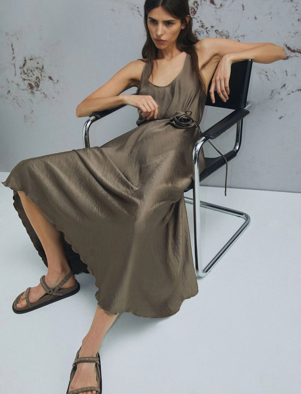 MiLA Boutique taupe crinkle twill dress with scoop neck, fabric belt with flower detail, and asymmetrical hem.