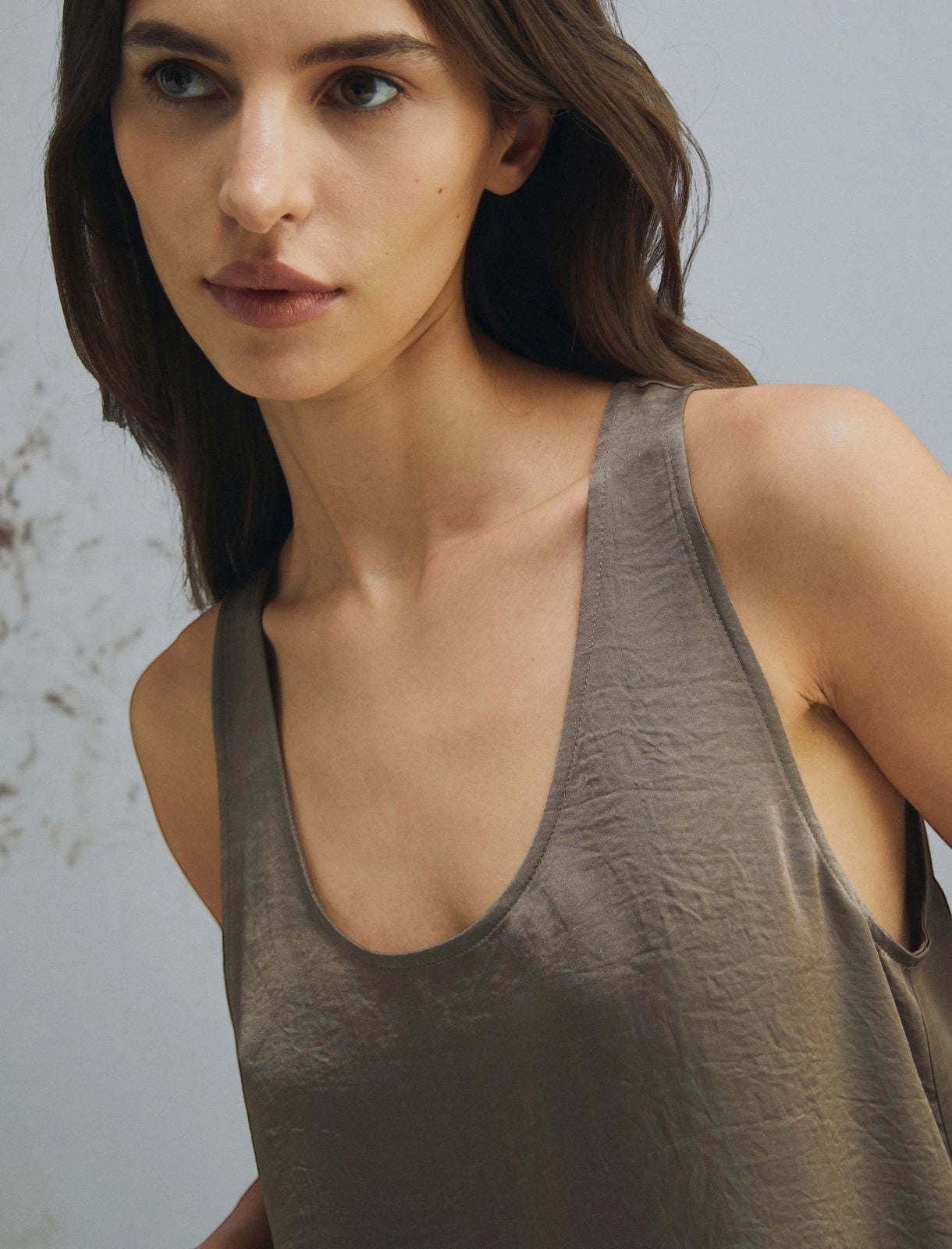 MiLA Boutique taupe crinkle twill relaxed fit tank top with rounded neckline and side slits.