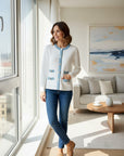 MiLA Boutique white textured knit cardigan with blue trim and button front, round neckline, and faux pockets.