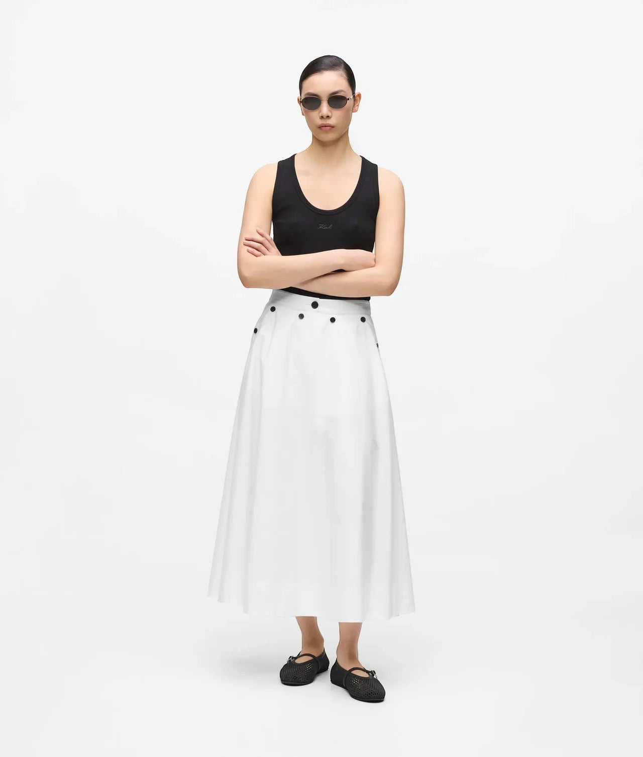 MiLA Boutique white A-line midi skirt with black button details and pockets, worn by a model.