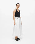 MiLA Boutique white A-line midi skirt with black button details and pockets, worn by a model.