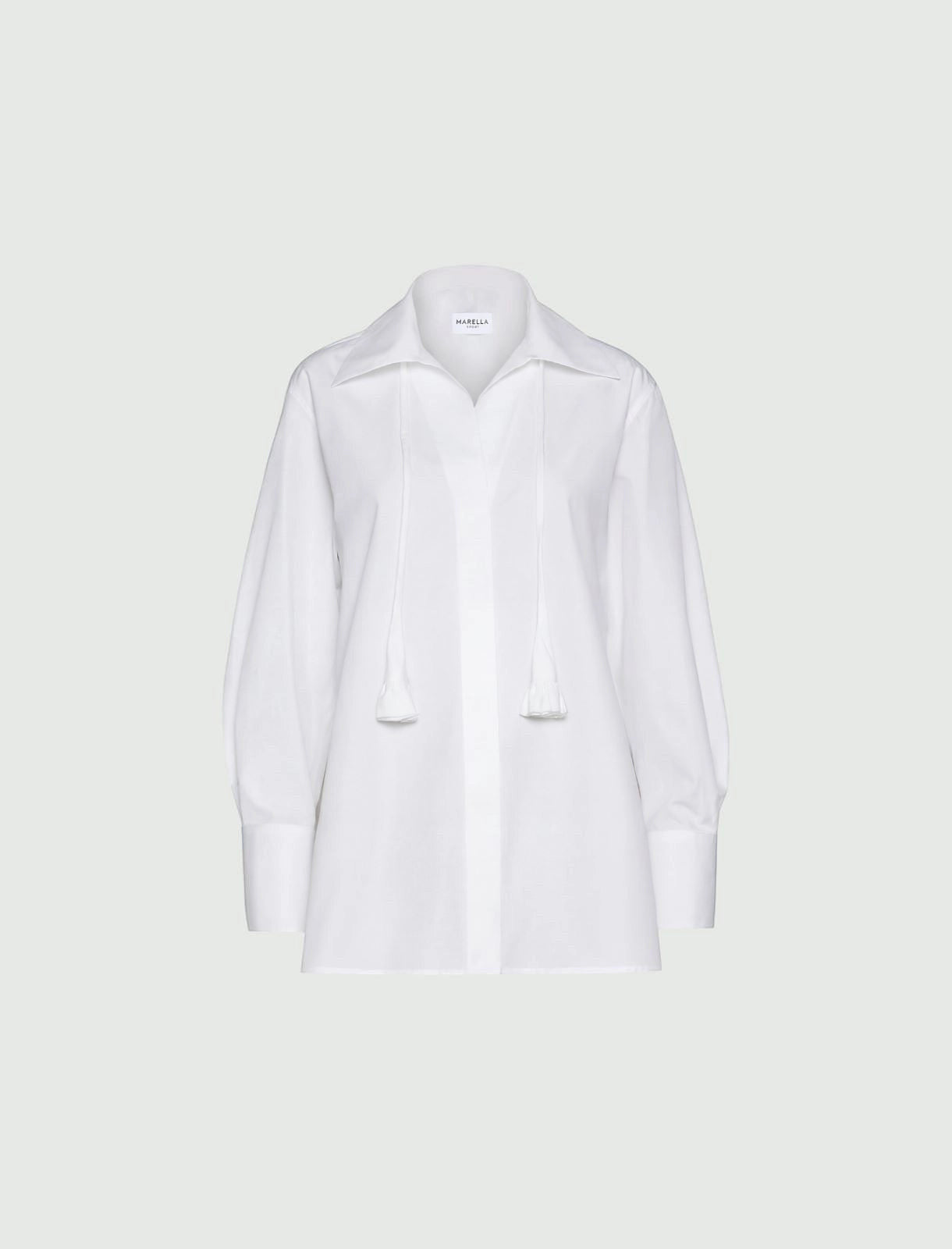 MiLA Boutique white cotton poplin shirt with a classic collar, concealed buttons, and decorative neckerchief with fabric flower detail.