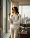 MiLA Boutique white cotton raglan sweater with gold fan-stitch embellishments on sleeves and neckline.