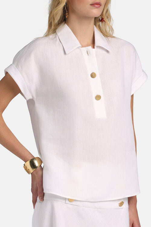 MiLA Boutique white linen polo shirt with gold buttons, cap sleeves, and turn-up cuffs.
