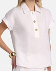 MiLA Boutique white linen polo shirt with gold buttons, cap sleeves, and turn-up cuffs.