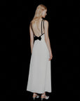 MiLA Boutique white envers satin backless maxi dress with black trim and bow detail, halterneck, elegant evening wear.