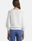 MiLA Boutique white cotton sweater with puff raglan sleeves featuring crochet-effect texturing, round neck, and flat-rib trims.
