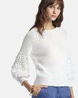MiLA Boutique white cotton sweater with puff raglan sleeves featuring crochet-effect texturing and round neckline.