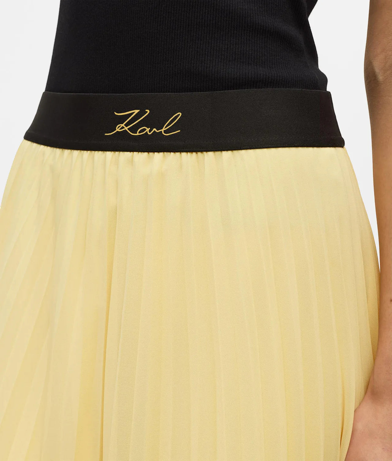 MiLA Boutique pale yellow satin pleated skirt with black elasticated waistband featuring embroidered Karl Lagerfeld signature logo.